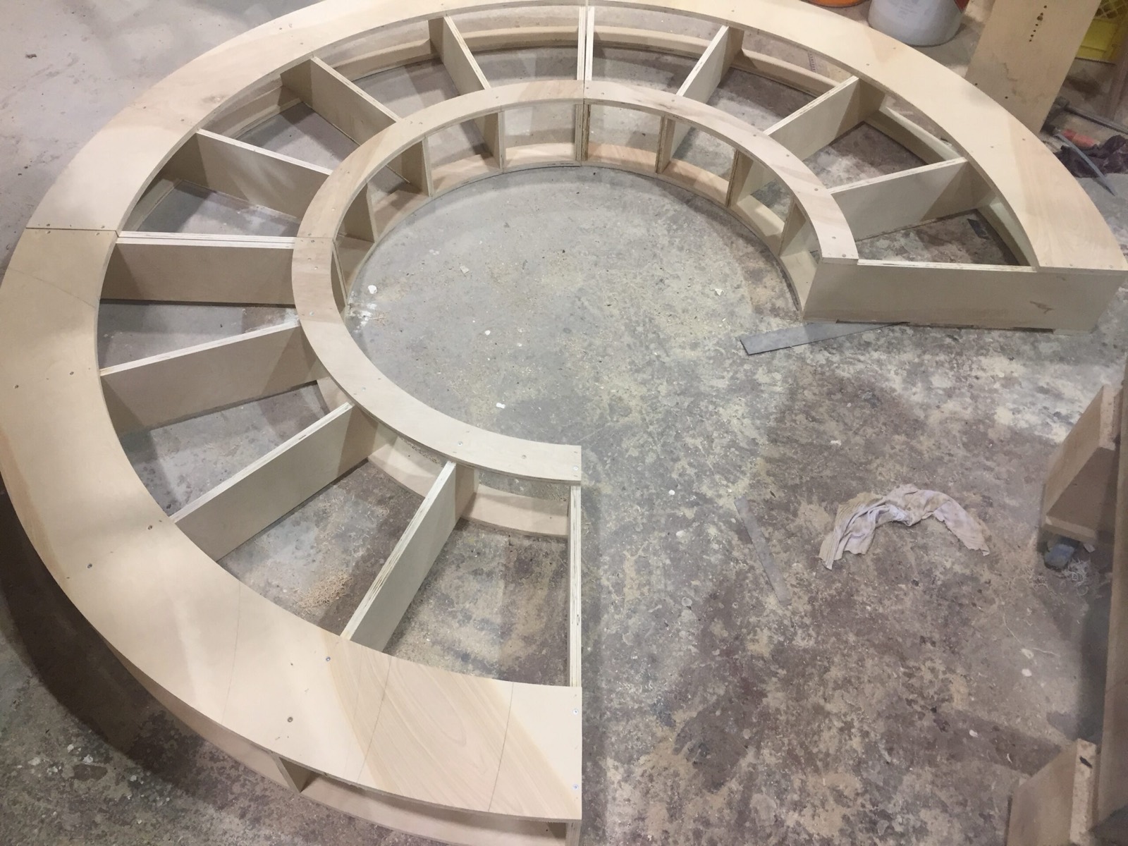 Round plywood booth seating frame under construction in the Pete's Seats workshop