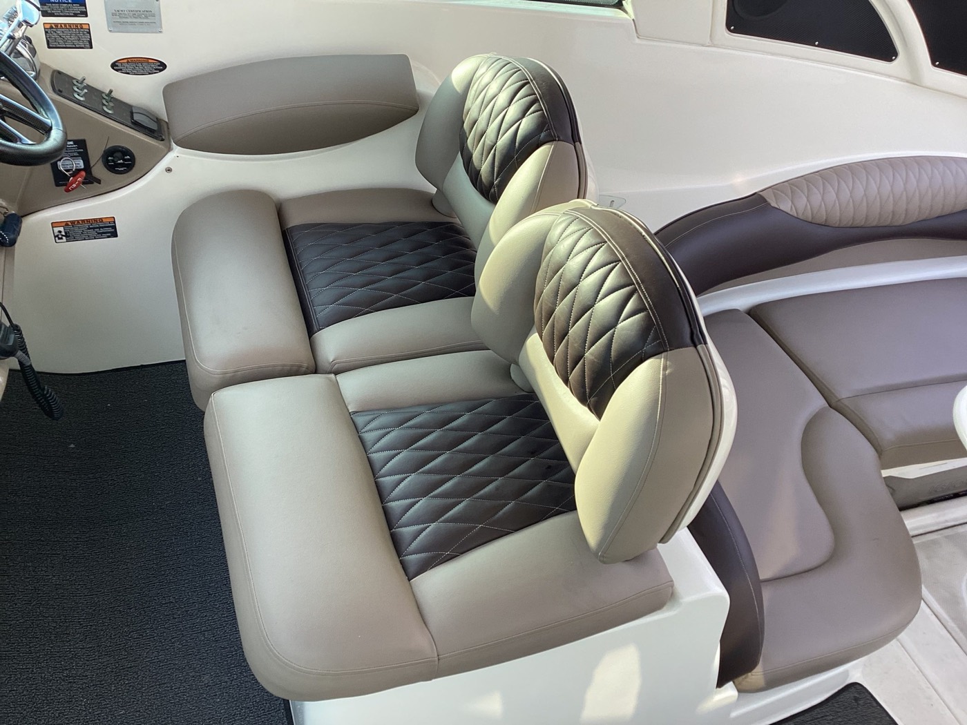Diamond-quilted marine boat seat cushions in tan vinyl