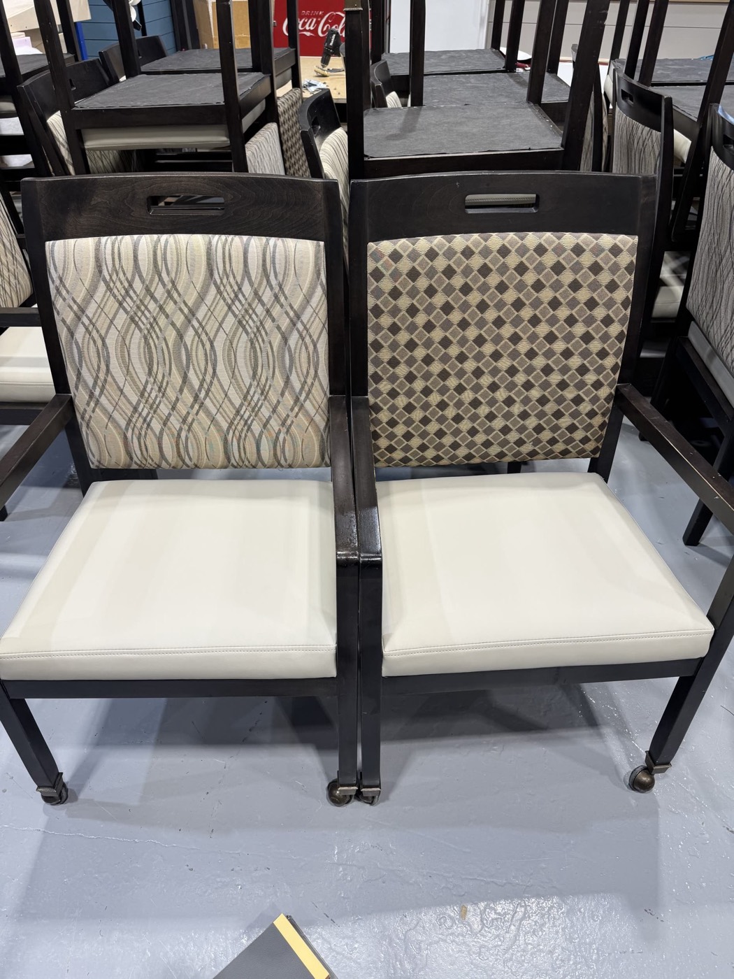 Stack of dining chairs reupholstered in a range of fabric patterns